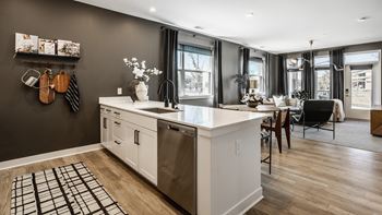 Living room and kitchen with wood flooring at Nuvo Flats, Merrillville, 46410